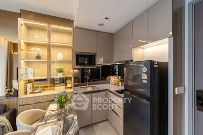 Modern kitchen with sleek cabinets and built-in appliances in luxury apartment