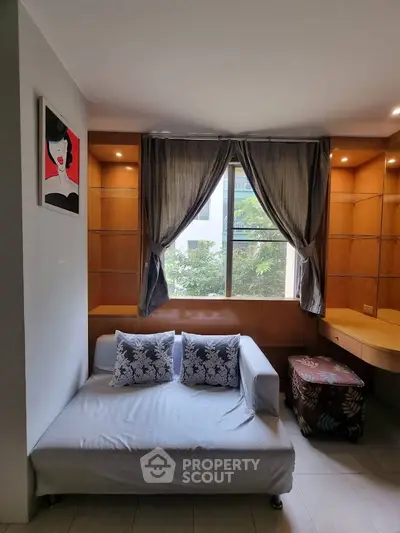 Cozy living room with stylish sofa and elegant window drapes