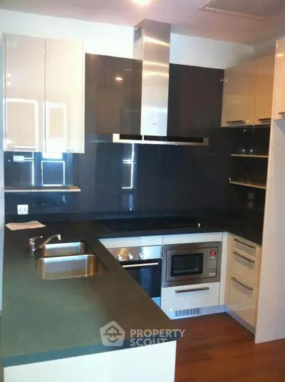 Modern kitchen with sleek appliances and stylish cabinetry
