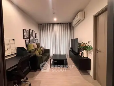 Modern living room with stylish decor, cozy sofa, and sleek entertainment unit, perfect for relaxation and entertainment.