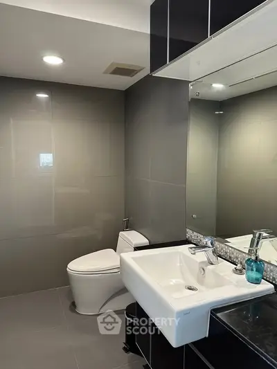 Modern bathroom with sleek fixtures and elegant design in a contemporary apartment.