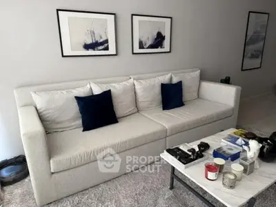 Modern living room with stylish sofa and decor, perfect for relaxation.