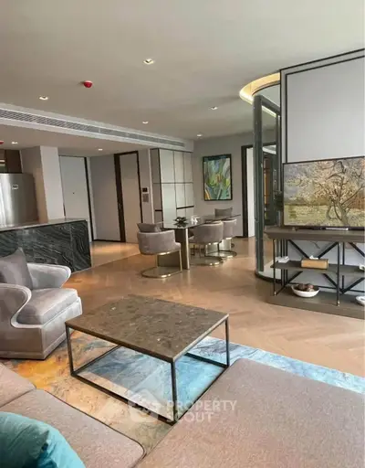 Luxurious open-plan living room with elegant dining area and modern decor