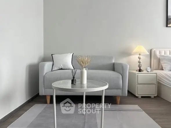 Modern living room with stylish gray sofa and elegant decor