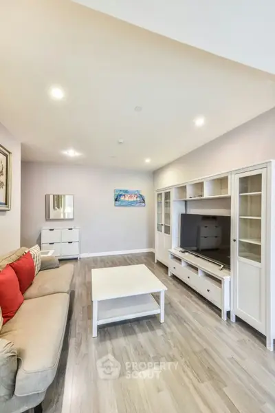 Spacious living room with modern furniture and elegant decor, perfect for relaxation and entertainment.