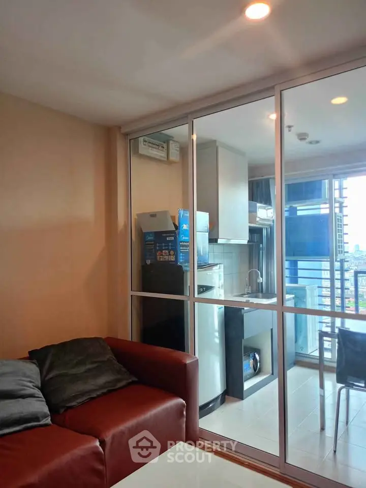 Modern living room with glass partition and city view balcony