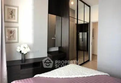 Elegant bedroom with mirrored wardrobe and stylish decor