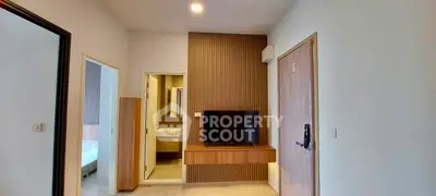 Modern apartment interior with sleek design and built-in TV unit