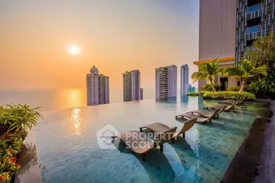 Luxurious rooftop infinity pool with stunning ocean and city skyline views at sunset.