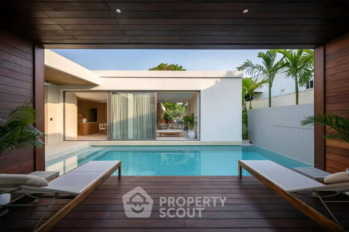 Luxurious modern home with stunning pool and open living space, perfect for relaxation and entertainment.