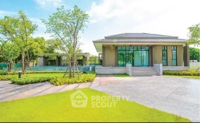 Luxurious modern house with spacious garden and elegant entrance