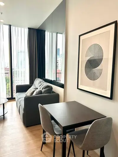 Modern living room with stylish decor, featuring a cozy sofa and dining area with city view.