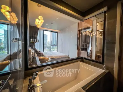 Luxurious bedroom with city view and modern bathtub in high-rise apartment
