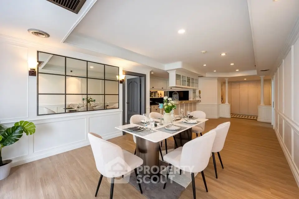Elegant dining area with modern decor and open layout in a luxurious apartment.
