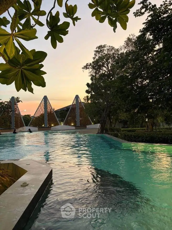 Luxurious outdoor pool area with serene evening ambiance and modern architectural features.