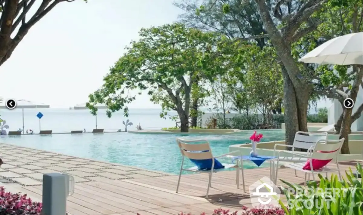 Luxurious beachfront pool area with elegant seating and ocean view