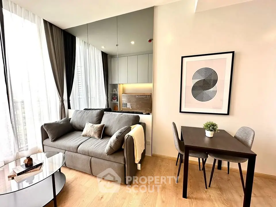 Modern living room with stylish decor, cozy sofa, and dining area in a bright apartment.