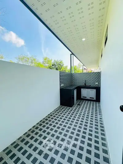 Modern outdoor kitchen with sleek design and open-air ambiance.