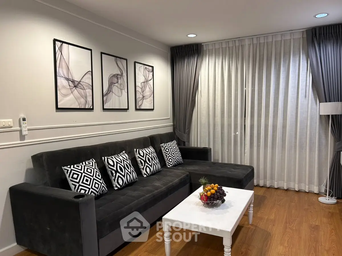 Stylish living room with modern decor and elegant curtains, perfect for relaxation and entertaining.