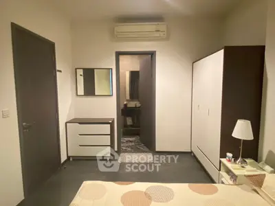 Cozy bedroom with modern furniture and ensuite bathroom, perfect for comfortable living.