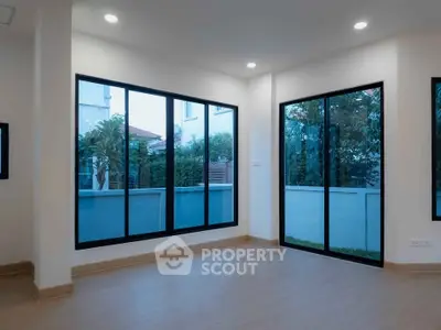 Spacious corner unit with large windows offering serene garden views, perfect for natural light lovers.