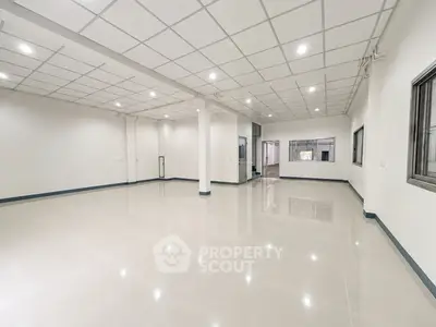 Spacious open-plan interior with modern ceiling and tiled flooring, ideal for versatile commercial or residential use.