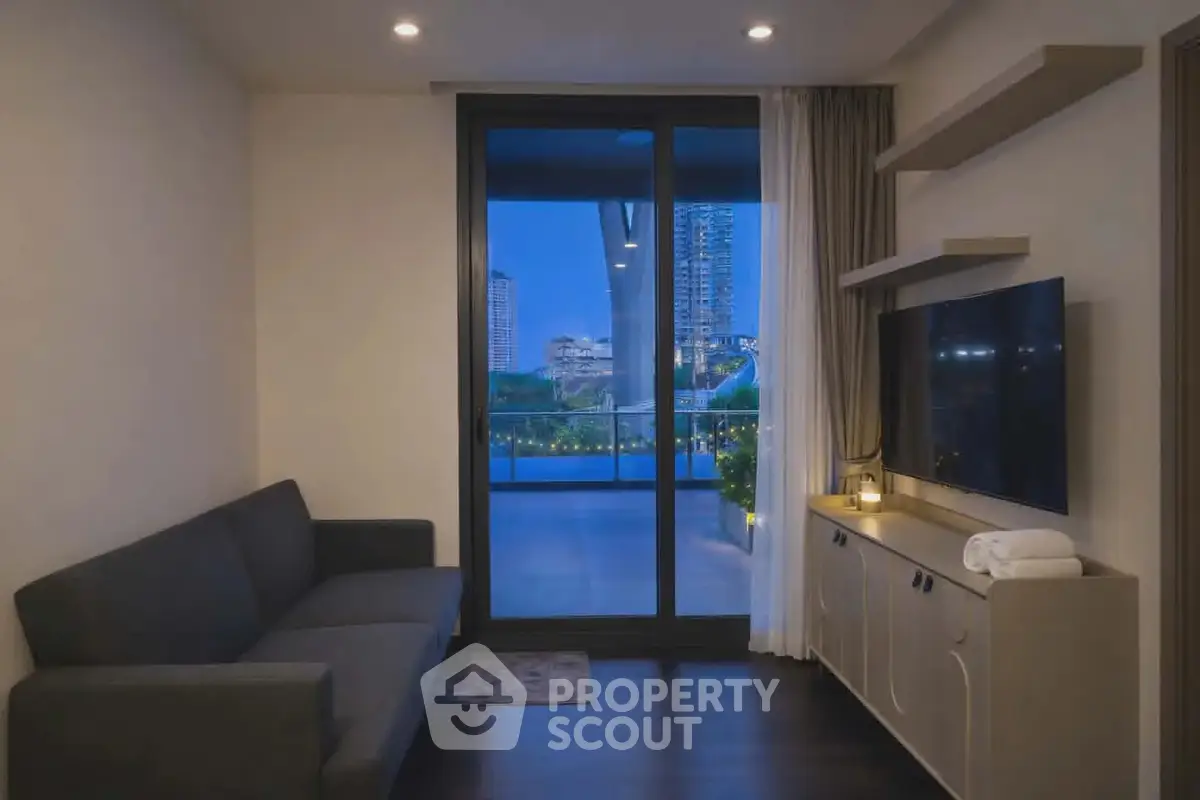 Modern living room with balcony view, sleek furniture, and ambient lighting.
