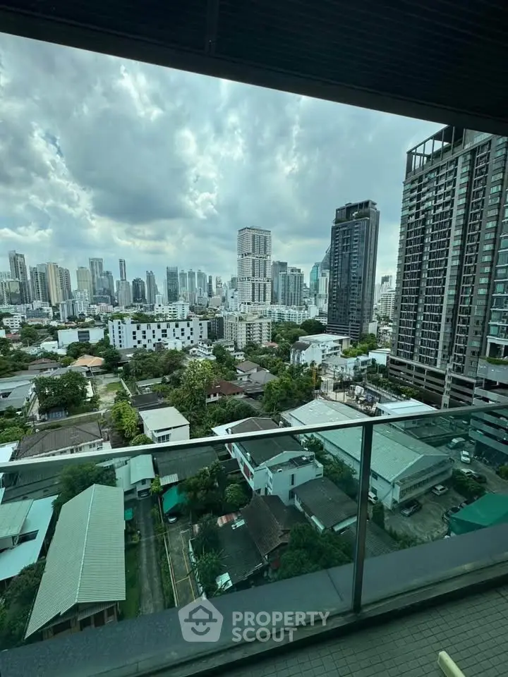 Stunning cityscape view from high-rise balcony with modern skyline