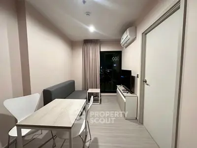 Modern living room with sleek furniture and city view, perfect for urban lifestyle.