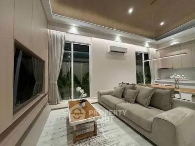 Modern living room with elegant decor and open kitchen layout