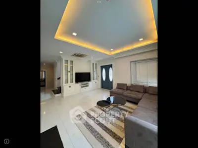 Spacious modern living room with elegant lighting and stylish furniture