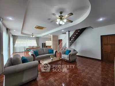Spacious living room with elegant furniture and modern lighting in a luxurious home