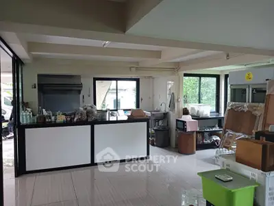 Spacious kitchen area with open layout and modern appliances, ideal for culinary enthusiasts.