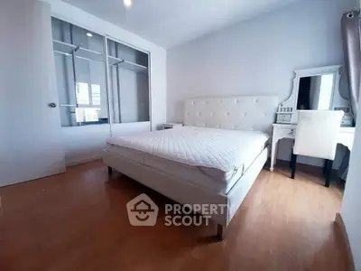 Spacious bedroom with modern decor and ample natural light