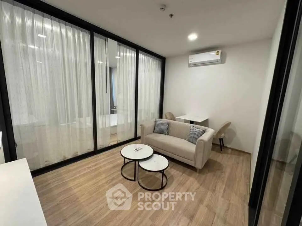 Modern living room with cozy sofa and stylish decor in a contemporary apartment.