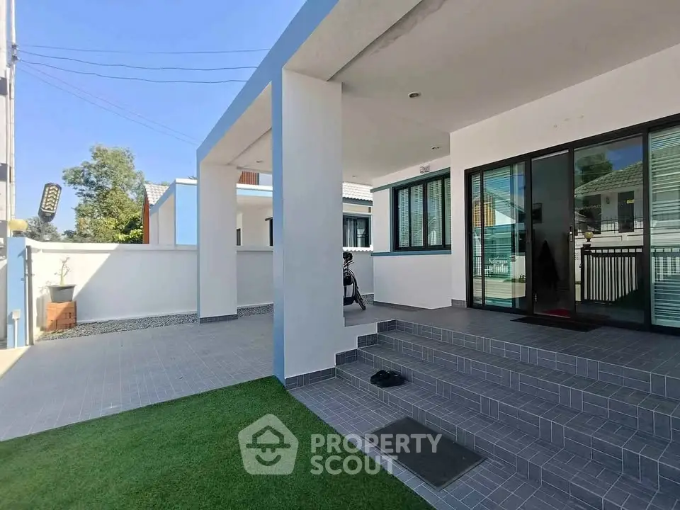 Modern home exterior with spacious patio and sleek design