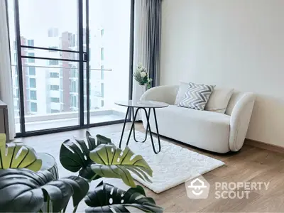 Modern living room with elegant sofa and city view balcony