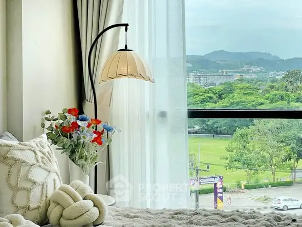 Cozy bedroom with scenic window view and elegant decor