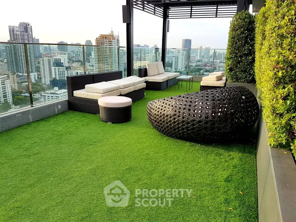 Luxurious rooftop terrace with stunning city views and modern outdoor seating.