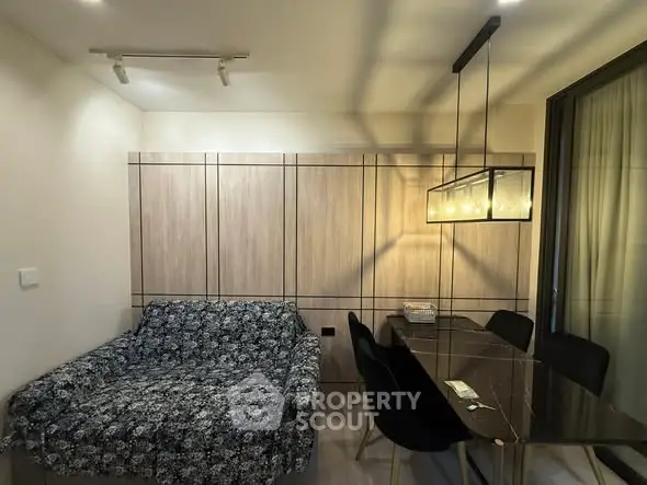 Modern living room with stylish dining area and cozy sofa