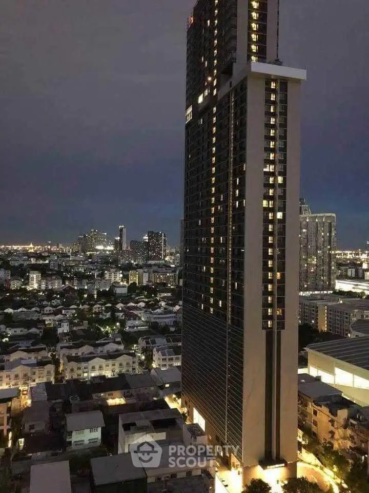 Stunning high-rise building with panoramic city views at dusk, showcasing urban living at its finest.
