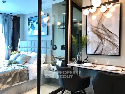 Modern bedroom with glass partition and elegant dining area, featuring stylish decor and ambient lighting.