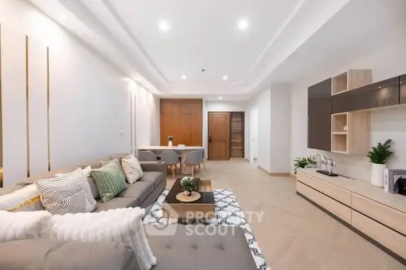 Spacious modern living room with elegant decor and ample natural light.