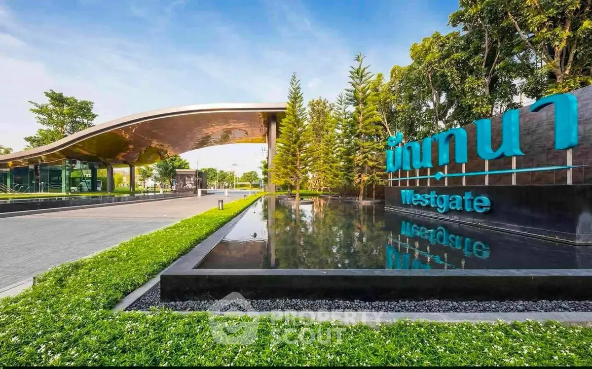 Stunning entrance of Westgate with modern architecture and lush greenery.