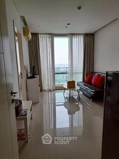 Modern living room with sleek design and city view balcony