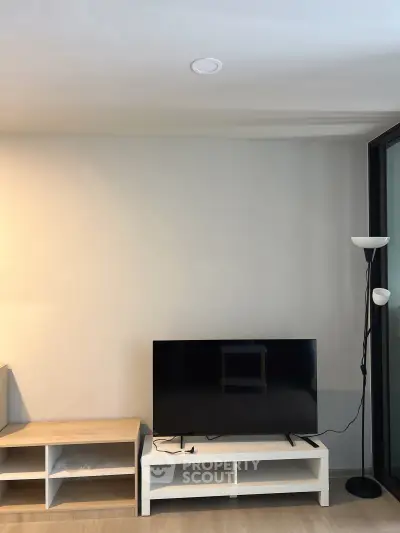 Modern living room with sleek TV setup and minimalist decor