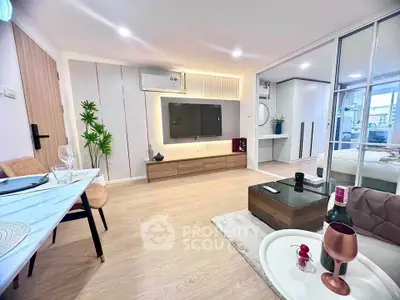 Modern living room with sleek decor and open layout leading to bedroom.