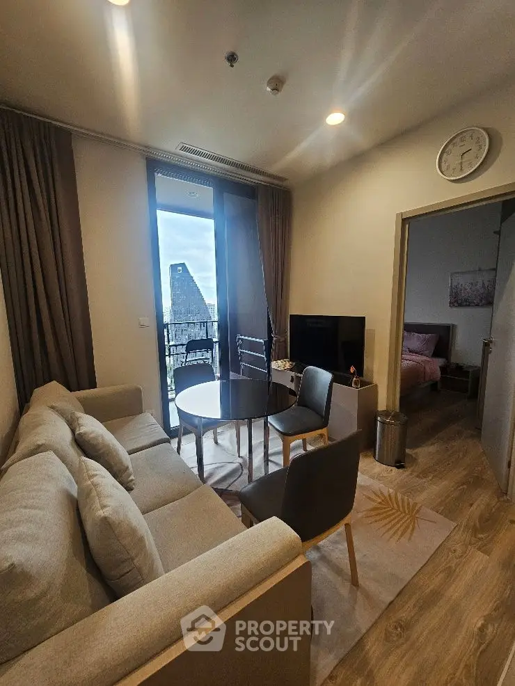 Cozy living room with balcony view and modern decor