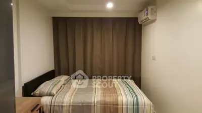 Cozy bedroom with modern air conditioning and stylish bedding in a serene setting.