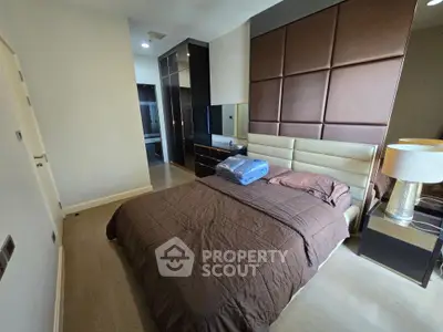 Luxurious bedroom with modern design and elegant furnishings, featuring a plush bed and stylish decor.